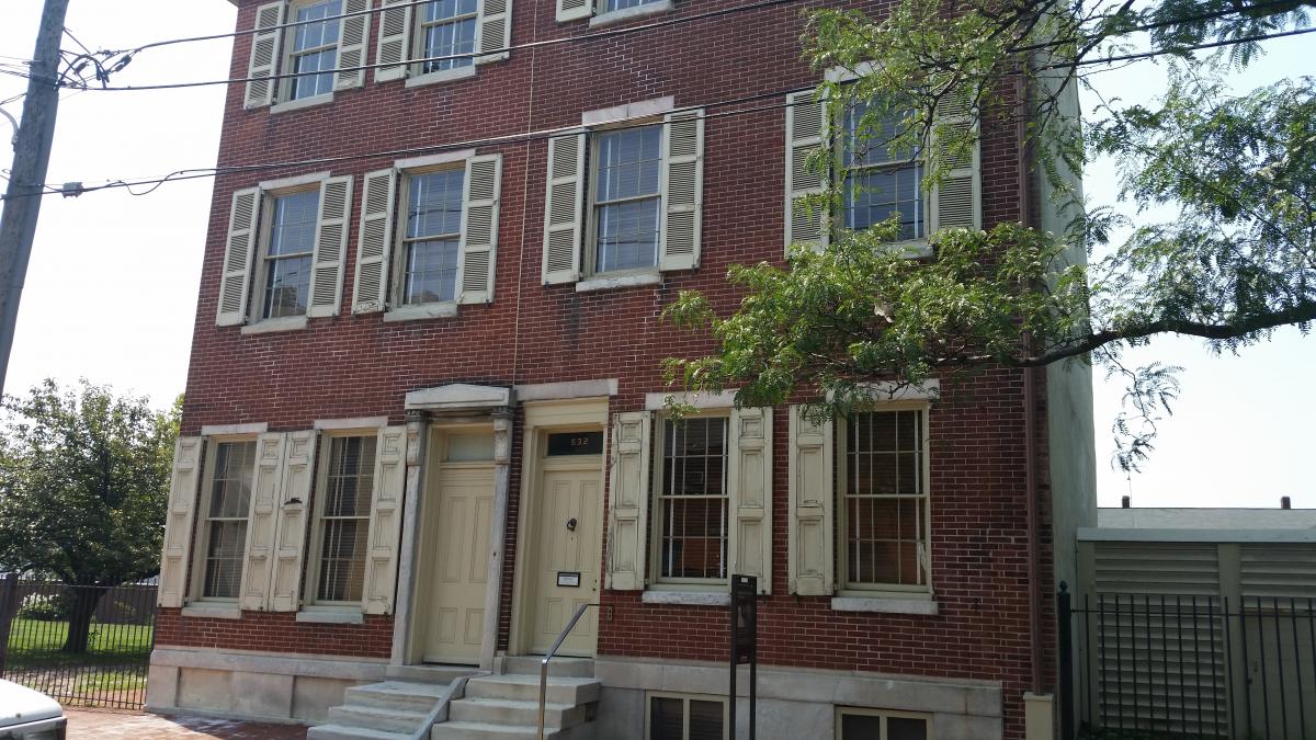 The Edgar Allan Poe House in Philadelphia on the Right